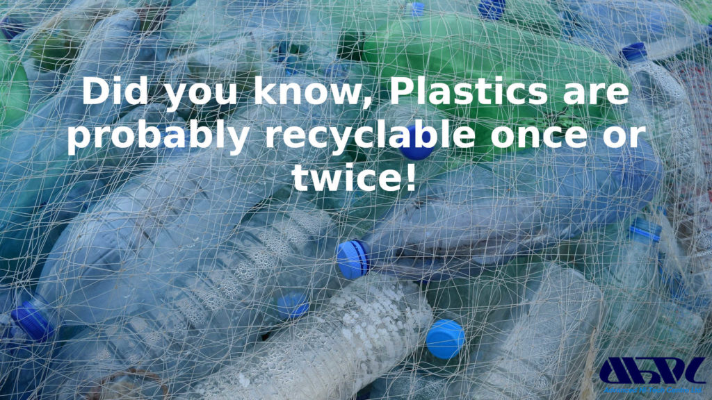 image shows a plastic net full of used plastic bottles